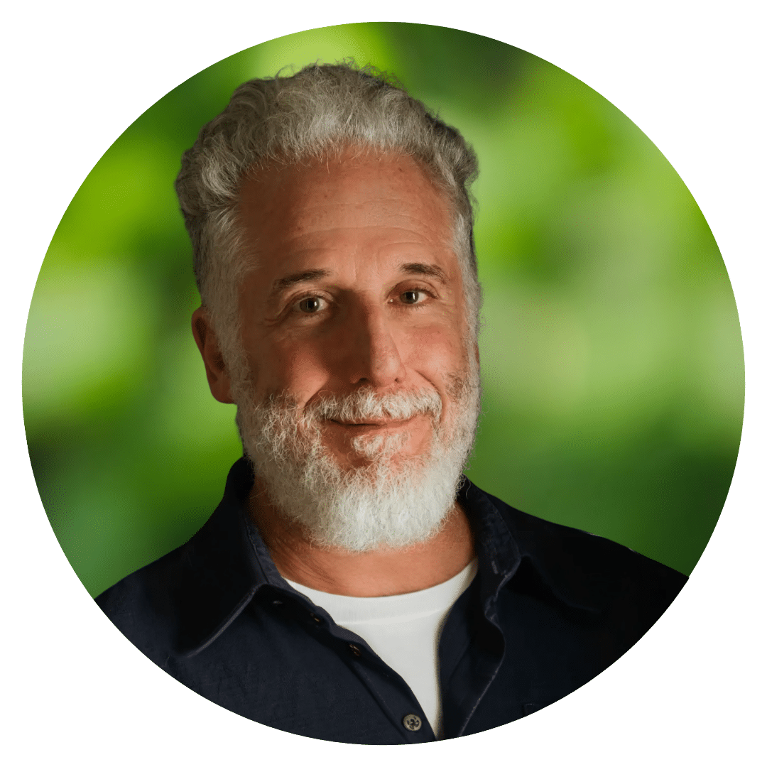 Circle cutout of Jamie B.'s professional headshot, with a background of leaves