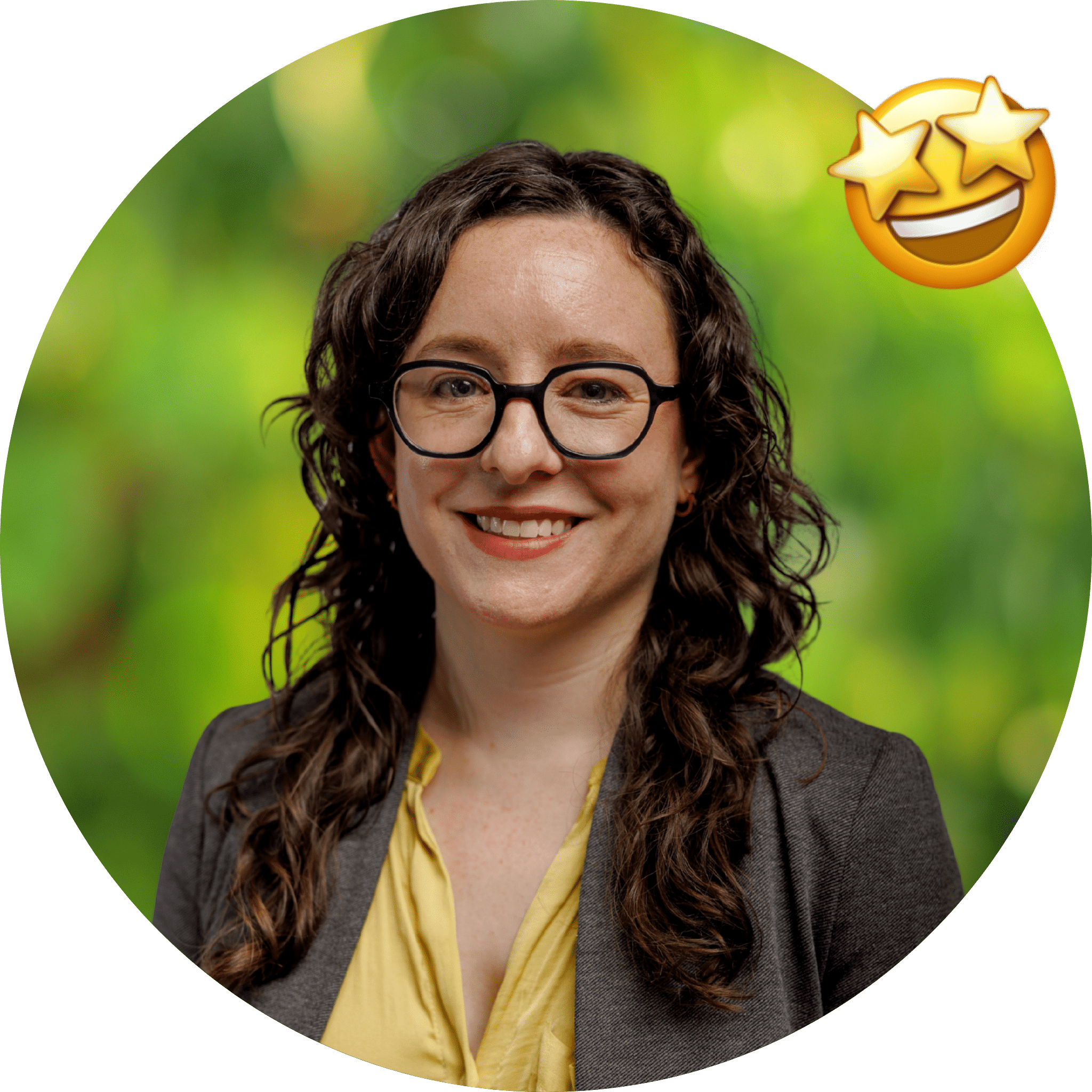 Circle cutout of Katie, with a background of green leaves