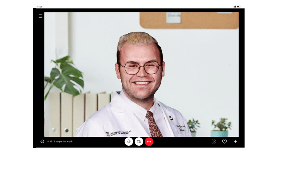 Cutout of a laptop showing a video call with a bsmd admissions coach smiling at the screen