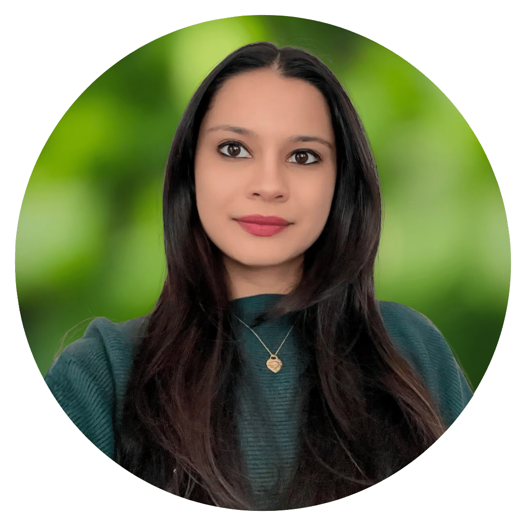 Circle cutout of Anjana S.'s professional headshot, with a background of leaves