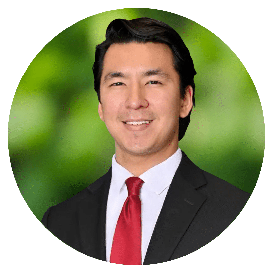 Circle cutout of Joseph H.'s professional headshot, with a background of leaves